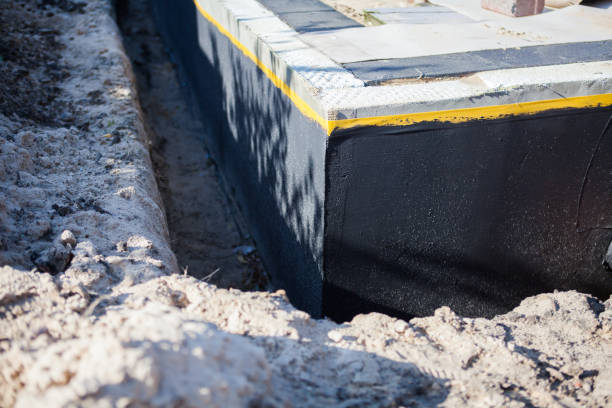 Professional Basement Waterproofing technician working in Eldorado, OH